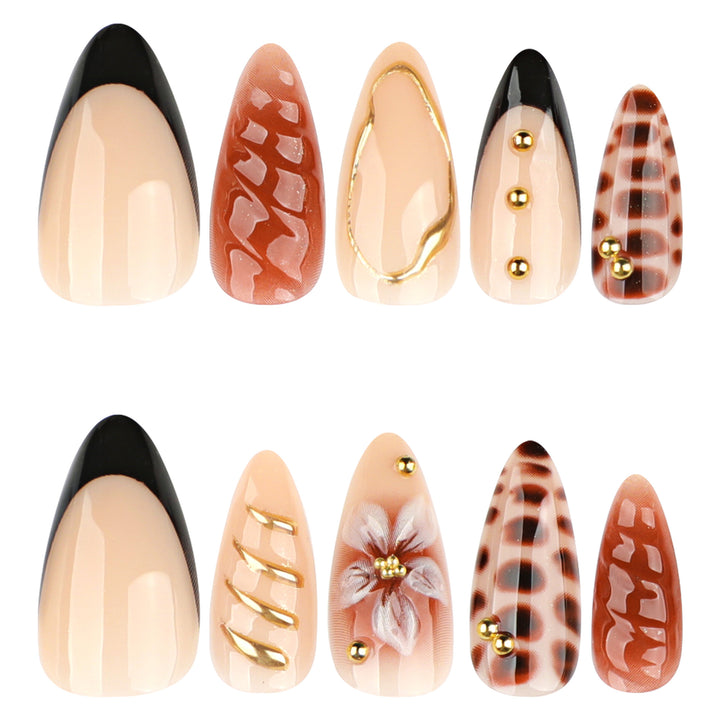 Artificial nails in modern stiletto design with golden accents Kalsten