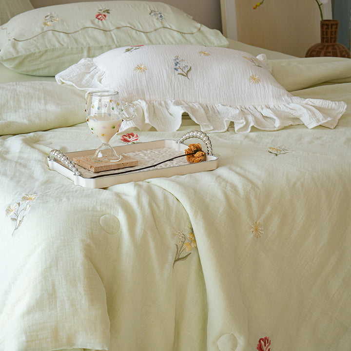 Light cotton gauze bedding set with fine floral embroidery and ruffle trim