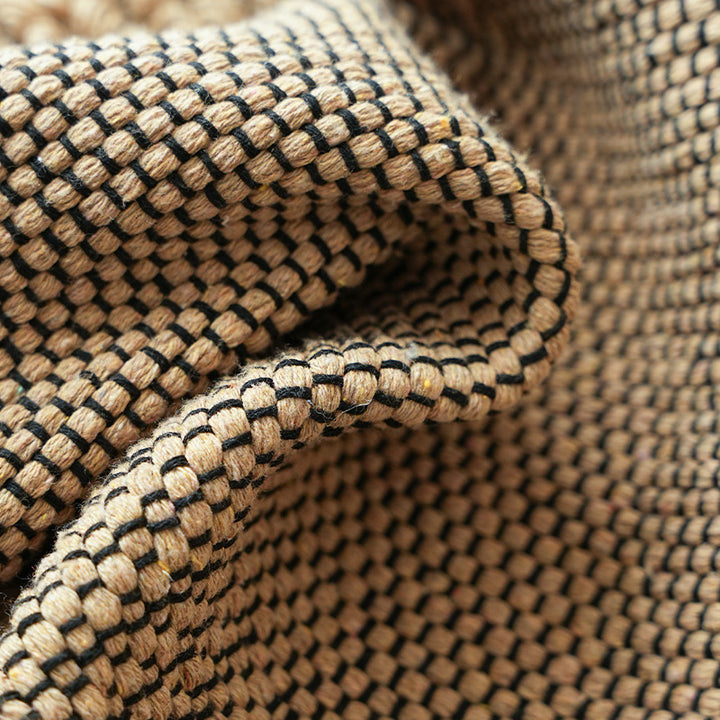 Handwoven structured cushion cover made of cotton blend with pompom trim Kalsten