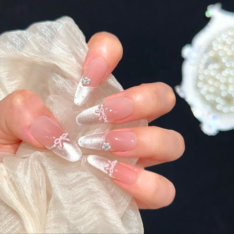 Artificial nail set with elegant bow and rhinestone embellishments Kalsten