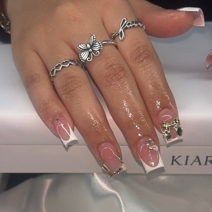 Artful Nail Art with Flower Design and Blue French Tip Kalsten