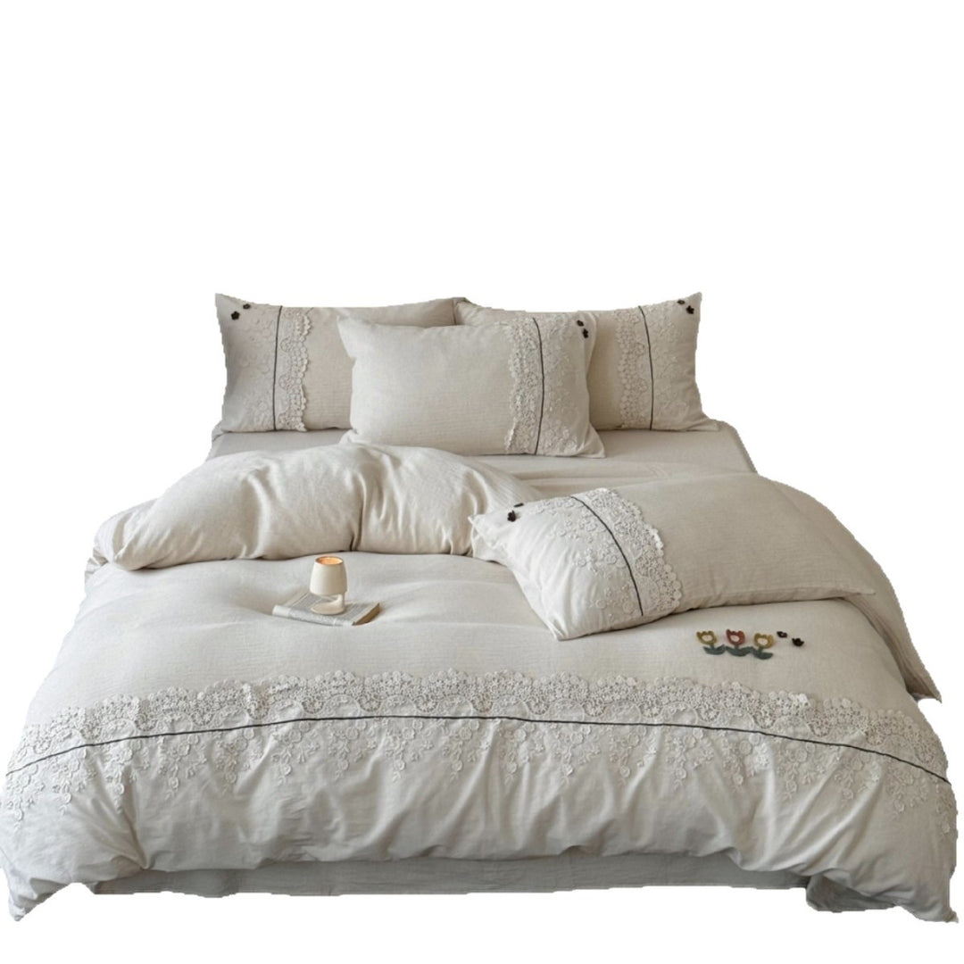 Bedding set in linen look with embroidered lace border and fine embroidery