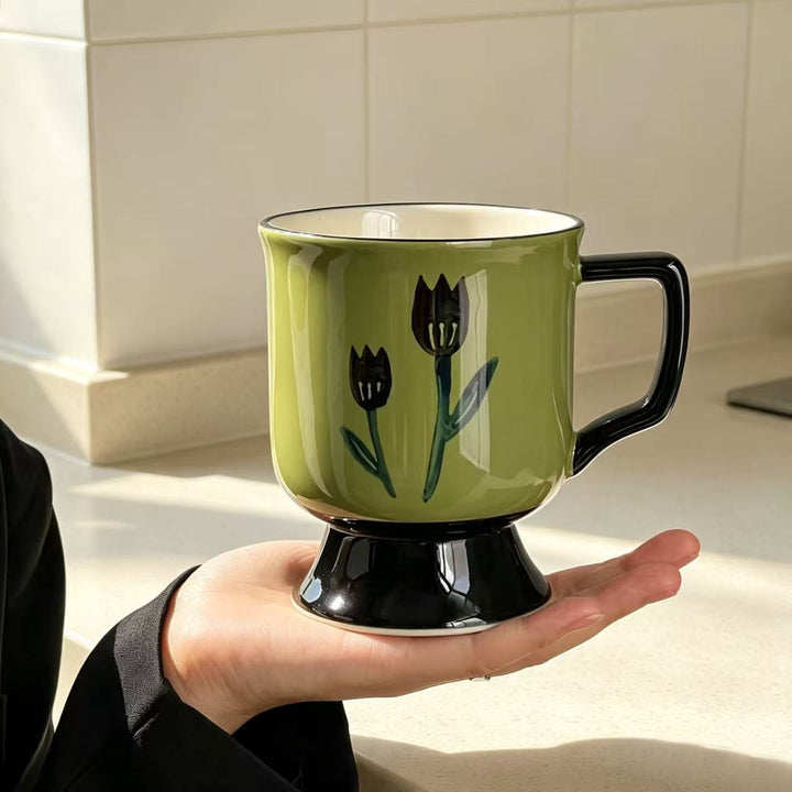 Ceramic cup with foot and hand-painted tulip motif