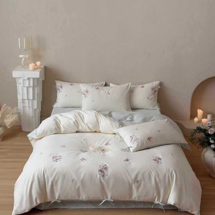 Luxurious cotton bedding set with delicate floral embroidery and reversible pillowcases