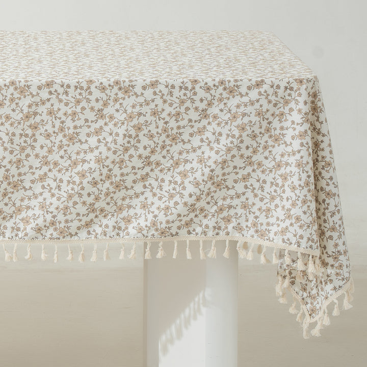 Rectangular tablecloth made of cotton-linen blend with delicate floral print and tassels