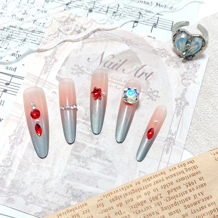 Glamorous artificial nails with rhinestones and embellishments Kalsten