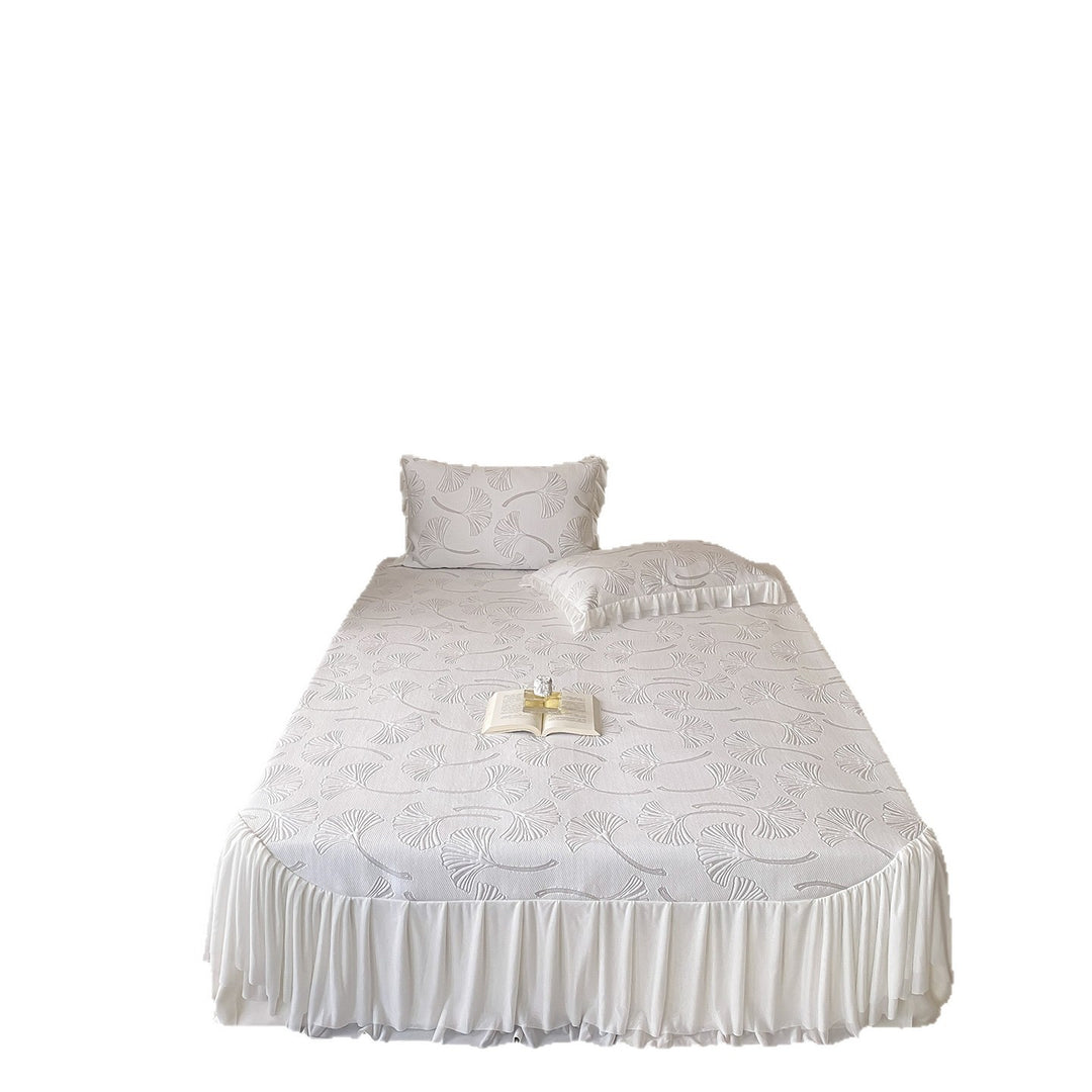 Quilted bedspread set with ginkgo leaf relief, ruffled bed skirt and pillowcases