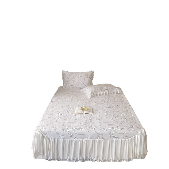 Quilted bedspread set with ginkgo leaf relief, ruffled bed skirt and pillowcases