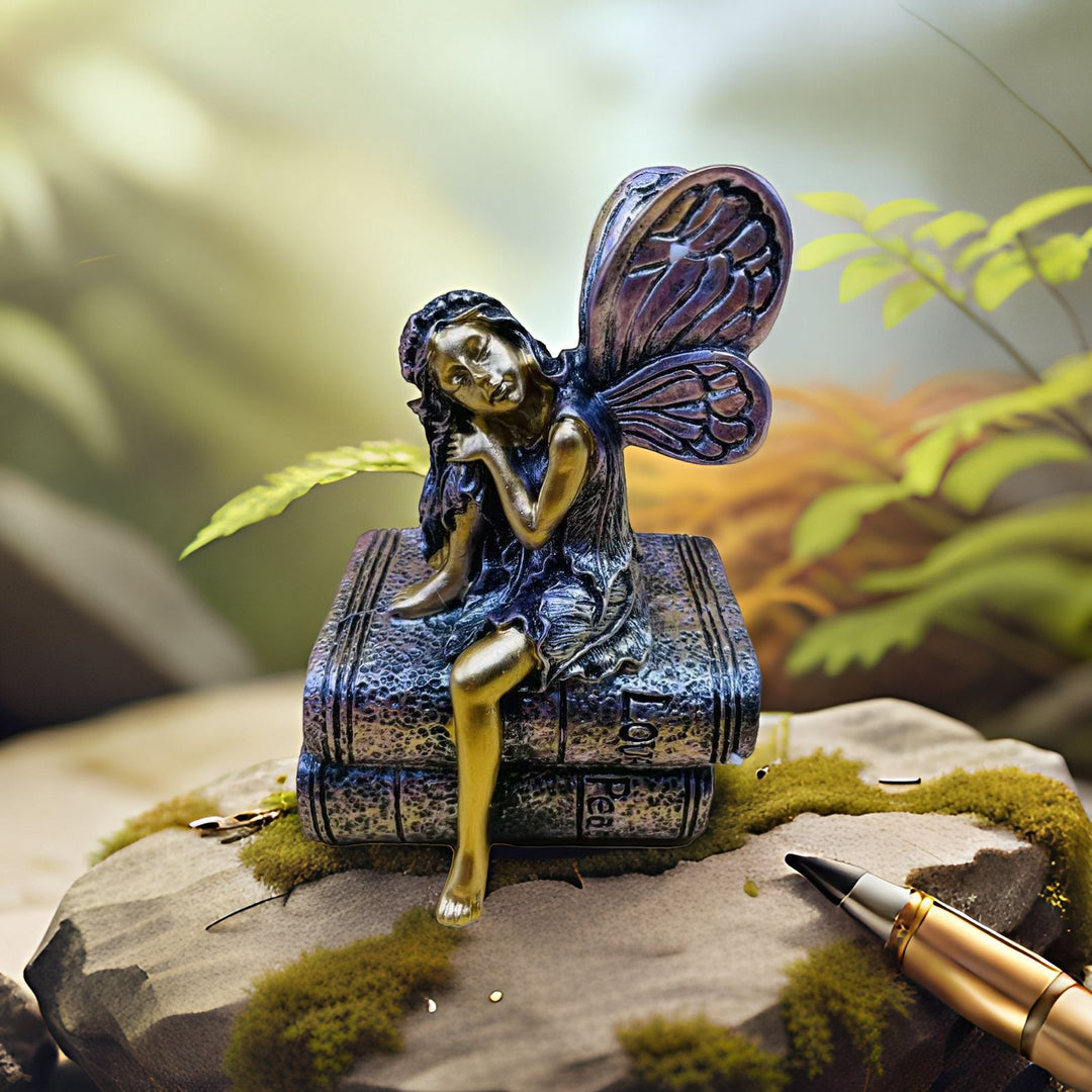 Fairy Figurine Sitting on Books Kalsten