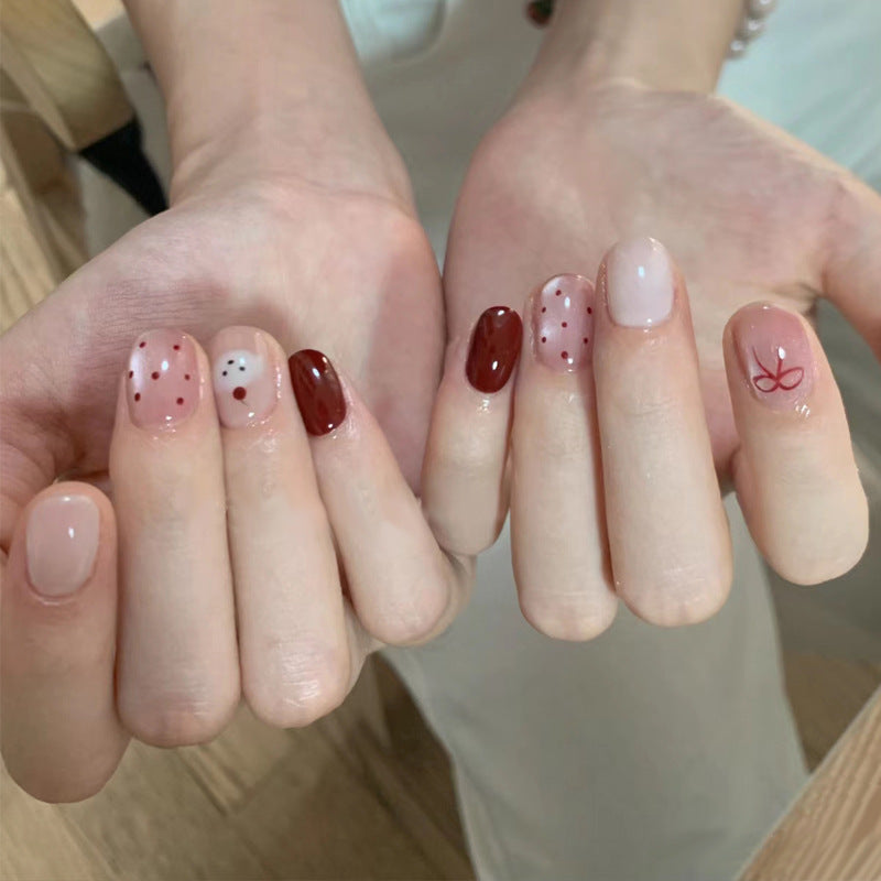Artistic Press-On Nail Set with Playful Polka Dot and Bow Designs Kalsten
