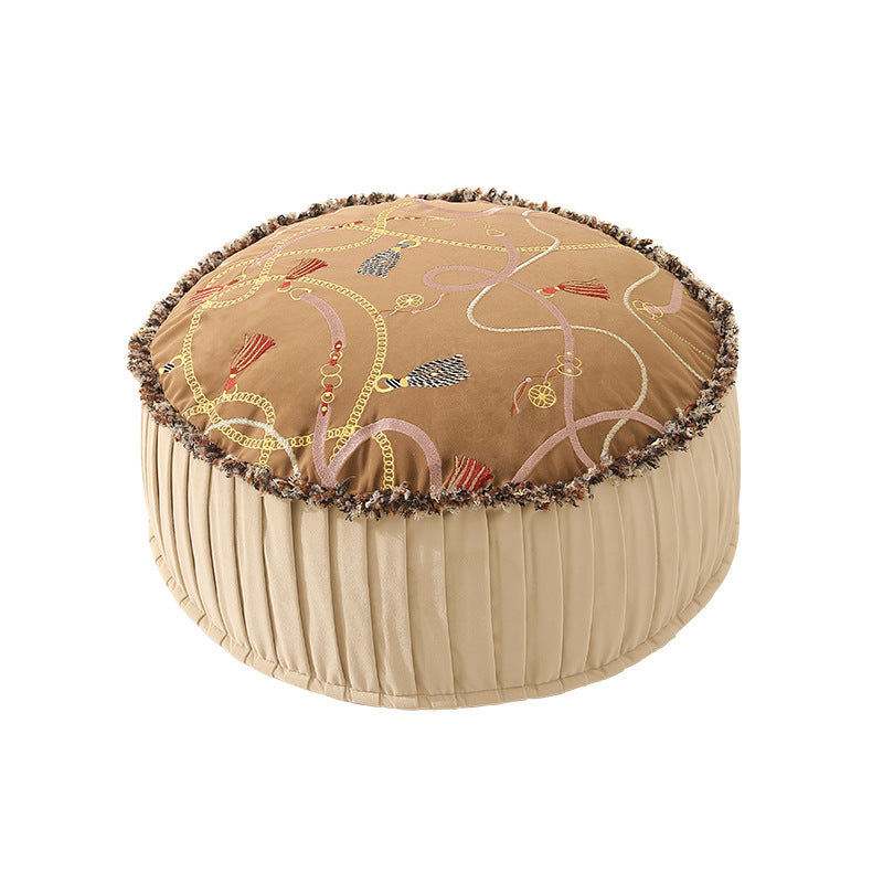 Beef seat pouf with embroidered top, pleated side panel and decorative fringe edge