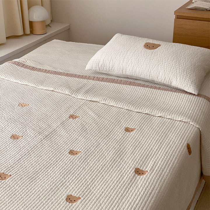 Padded quilt set with embroidered bear appliqués and neck roll