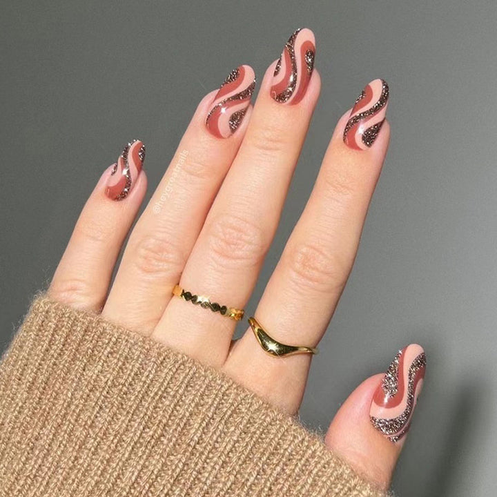 Artful nail extensions with an elegant leaf pattern Kalsten