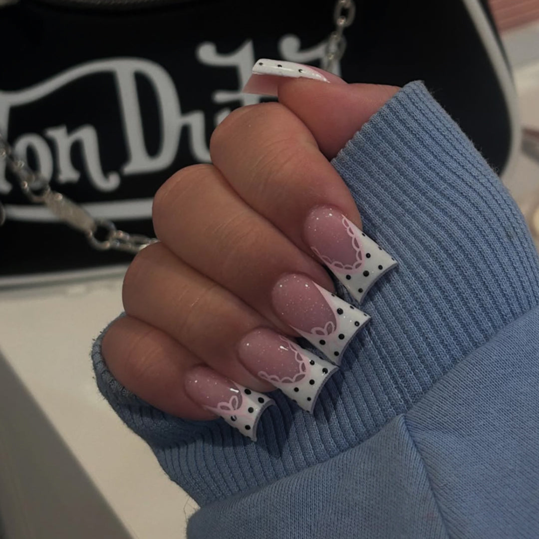 Artful Nail Art with Flower Design and Blue French Tip Kalsten