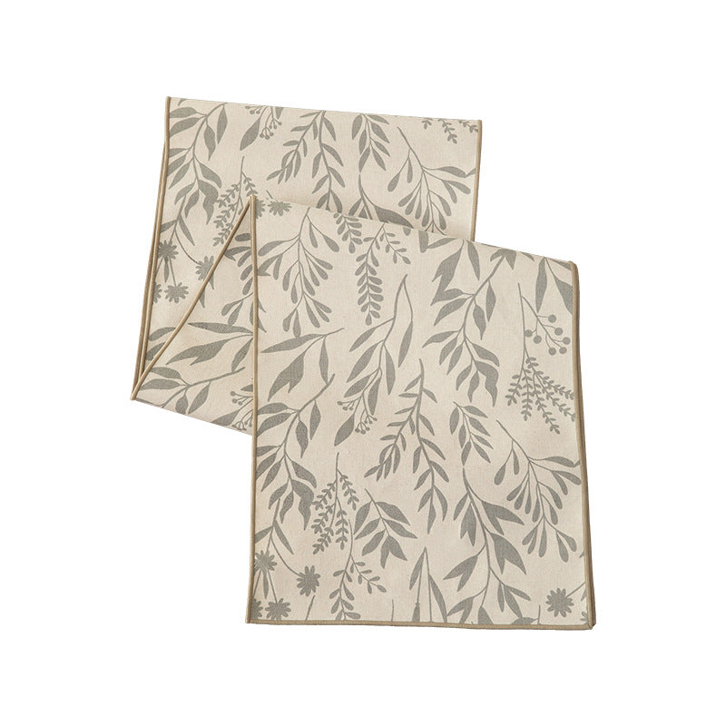Woven table runner in botanical leaf pattern made of cotton blend Kalsten