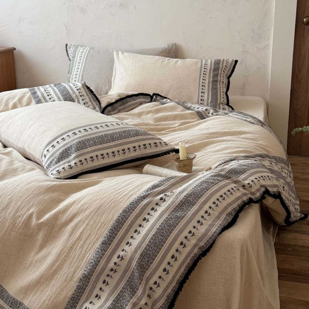 Country house style bedding set with striped floral border and fringes