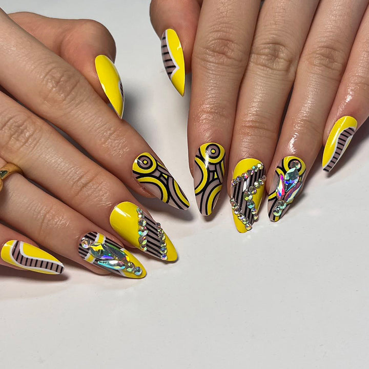 Artful nail extensions with geometric design and glitter accents Kalsten