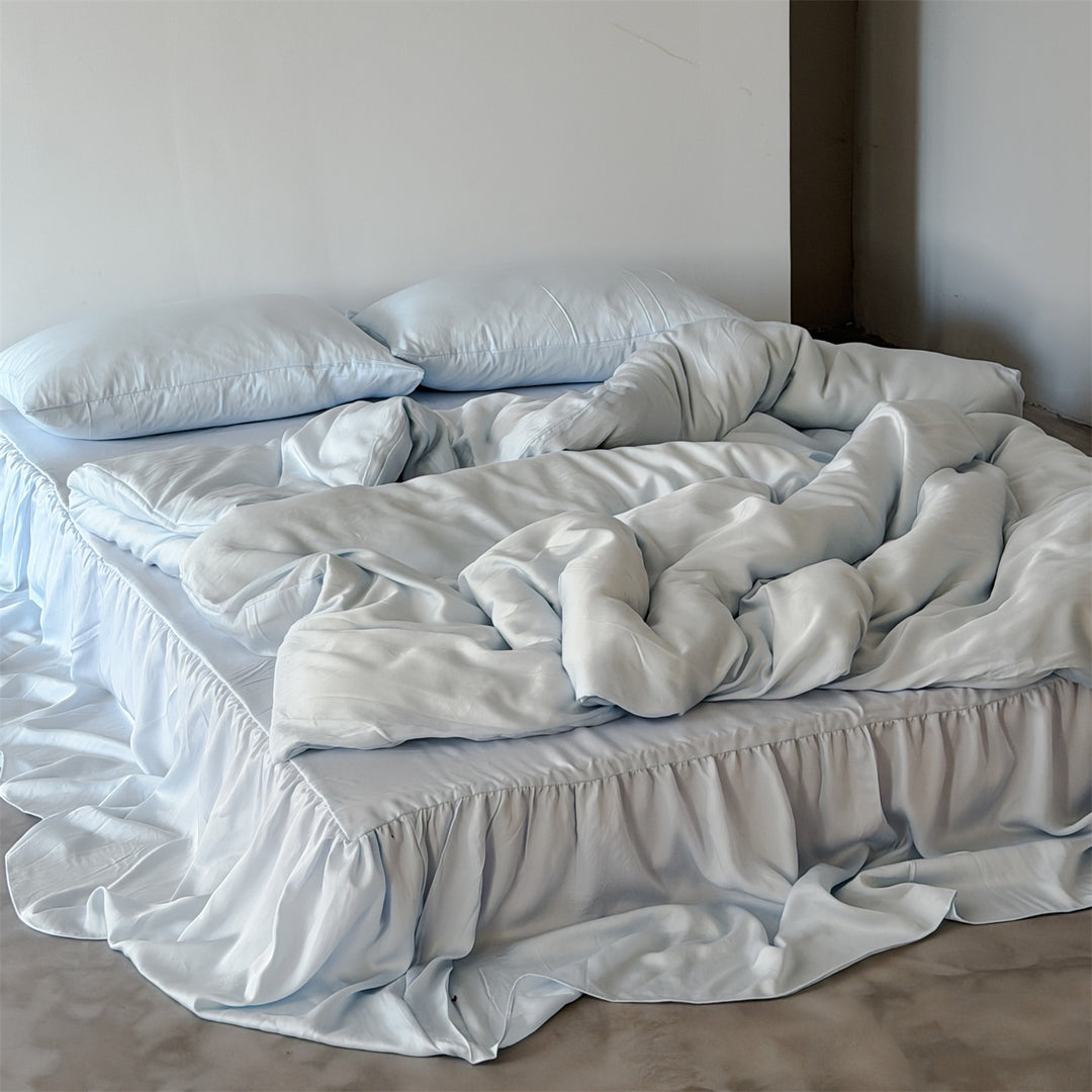 Bedding set with voluminous bed skirt and soft satin finish