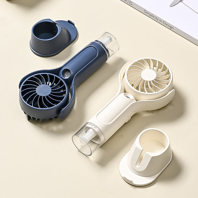 Unisex portable handheld fan with tiltable head, foldable stand and USB charging station Kalsten