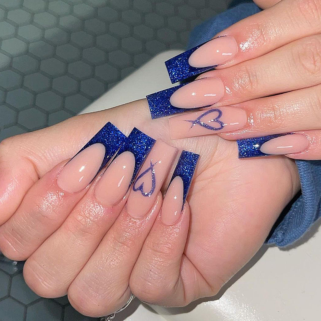 Artificial nails with glitter accents and unique heart design Kalsten