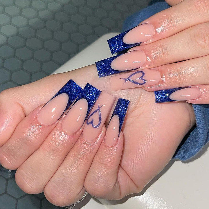 Artificial nails with glitter accents and unique heart design Kalsten
