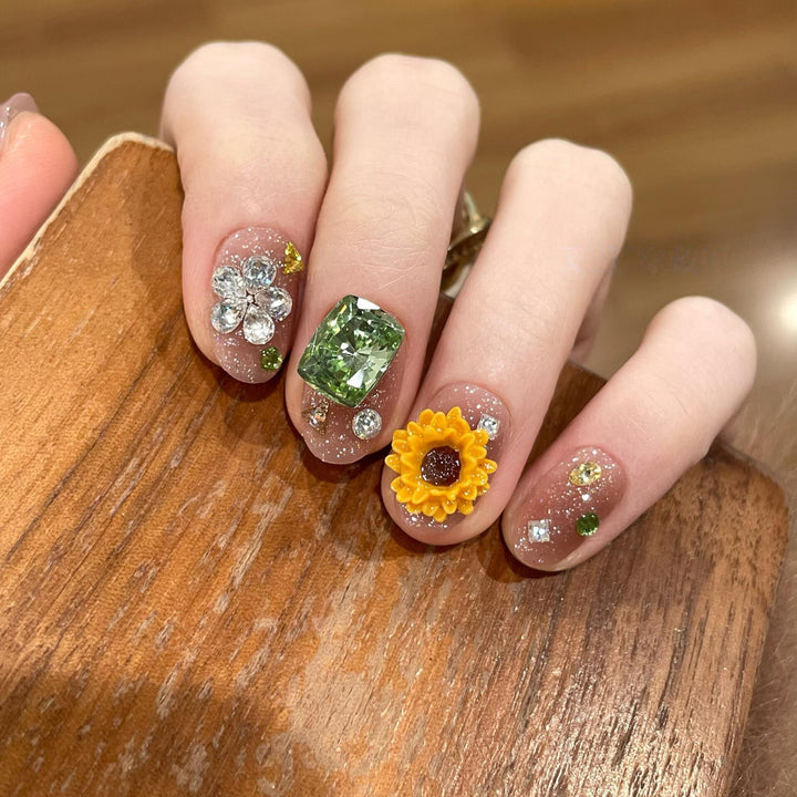 Artificial nails with sparkling appliqués and floral designs Kalsten