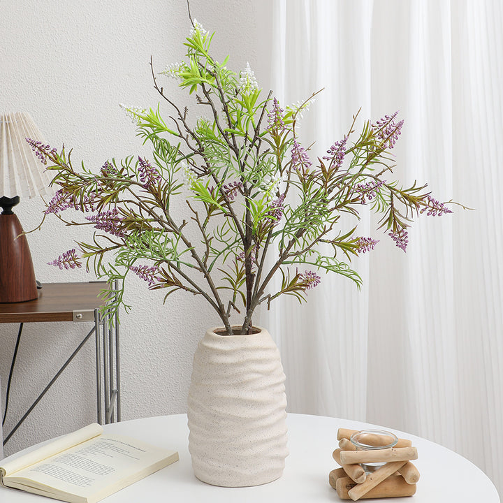 Artificial plant with decorative flowers
