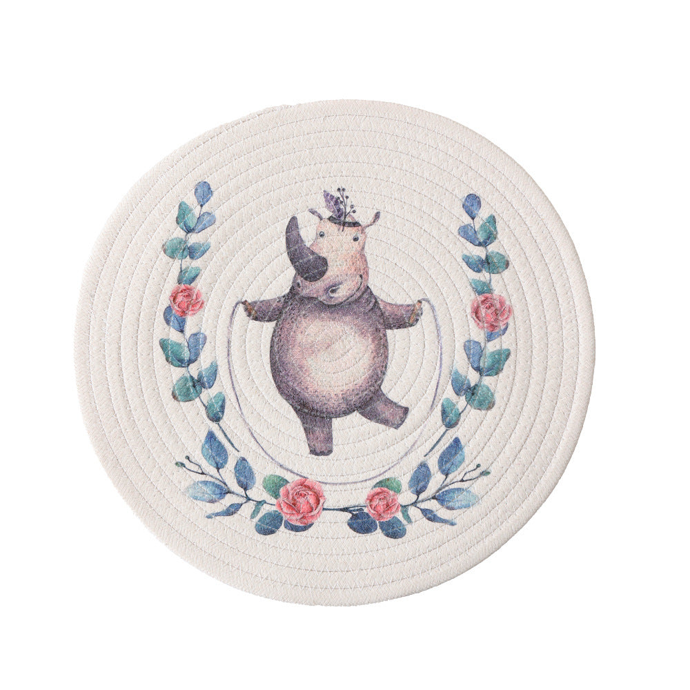 Round quilted table set placemat made of cotton blend with playful rhinoceros print