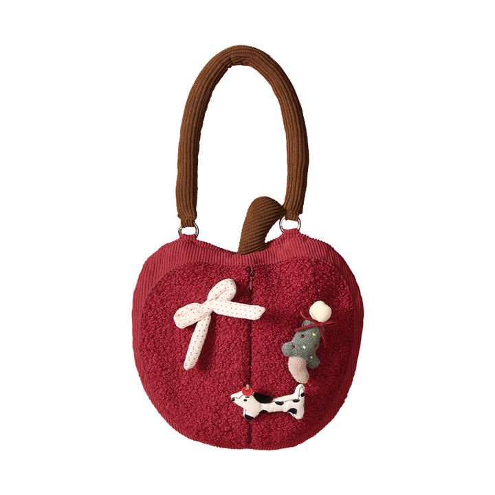 Wall-mounted handkerchief bag in apple shape with handle, plush applications and opening for tissues