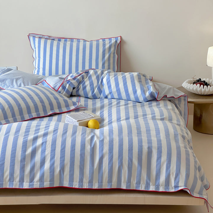 Striped duvet cover and pillowcase set with contrast piping