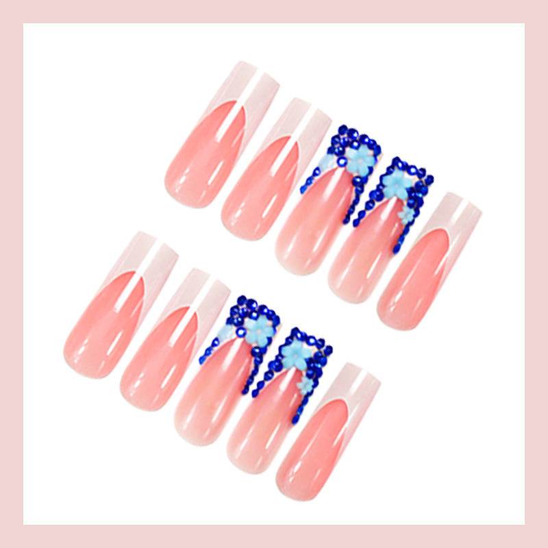 Artificial nail design with trendy blue accents and glitter coating Kalsten