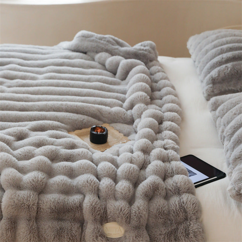 Faux fur blanket with ribbed structure design and velvety soft pile