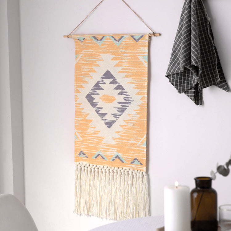Handcrafted cotton tapestry wall decoration with macrame fringes and geometric circle motif