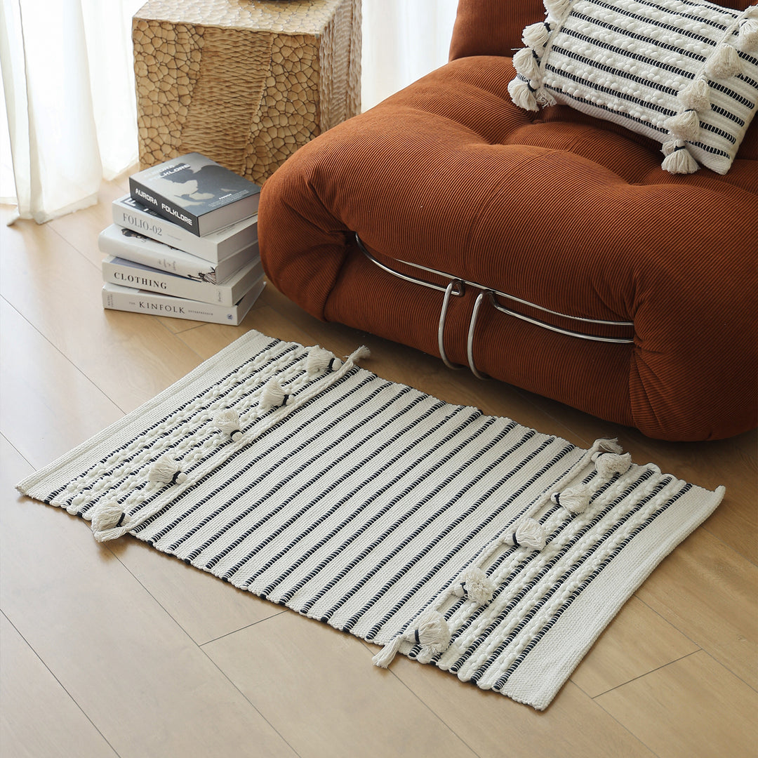 Handwoven runner with tassels and fine striped texture