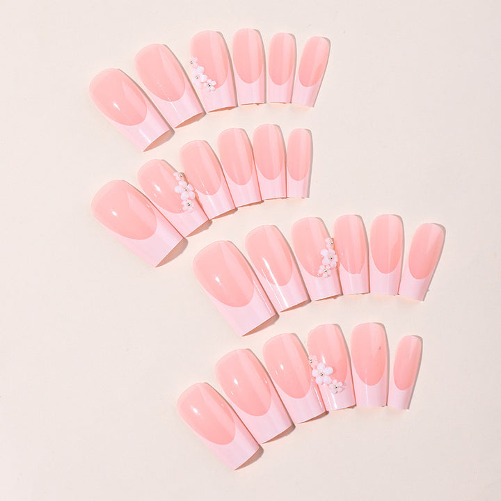 Artificial nail set with elegant French tips and hand-drawn flower motifs Kalsten