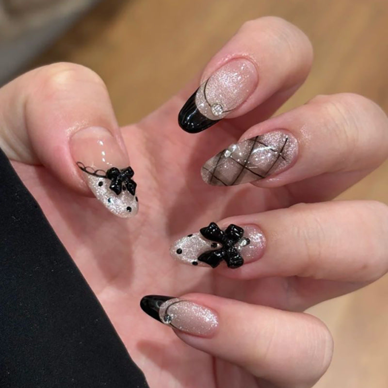 Artful Nail Art with Bow and Rhinestone Decorations Kalsten