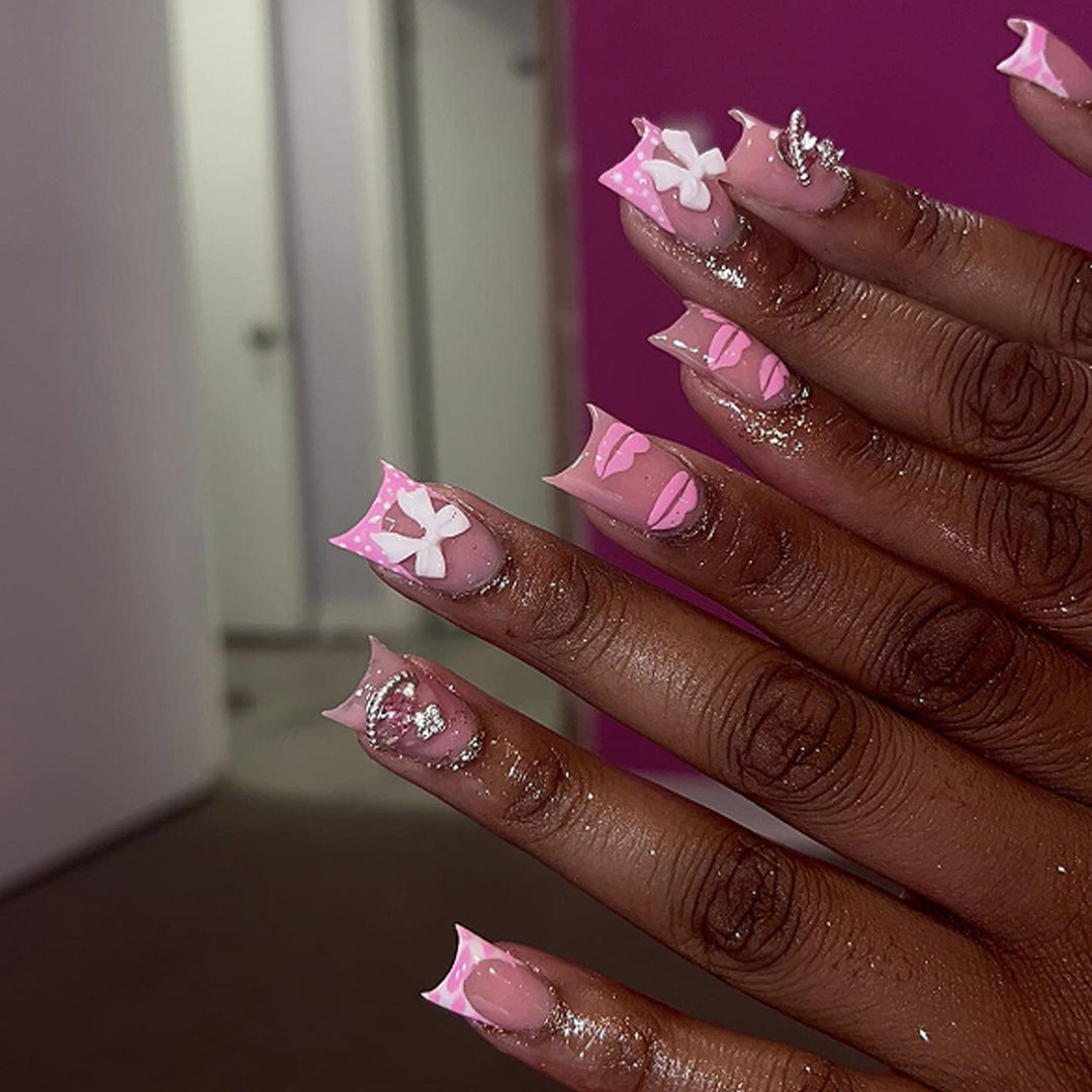 Artful Nail Art with Glitter and Flower Design Kalsten