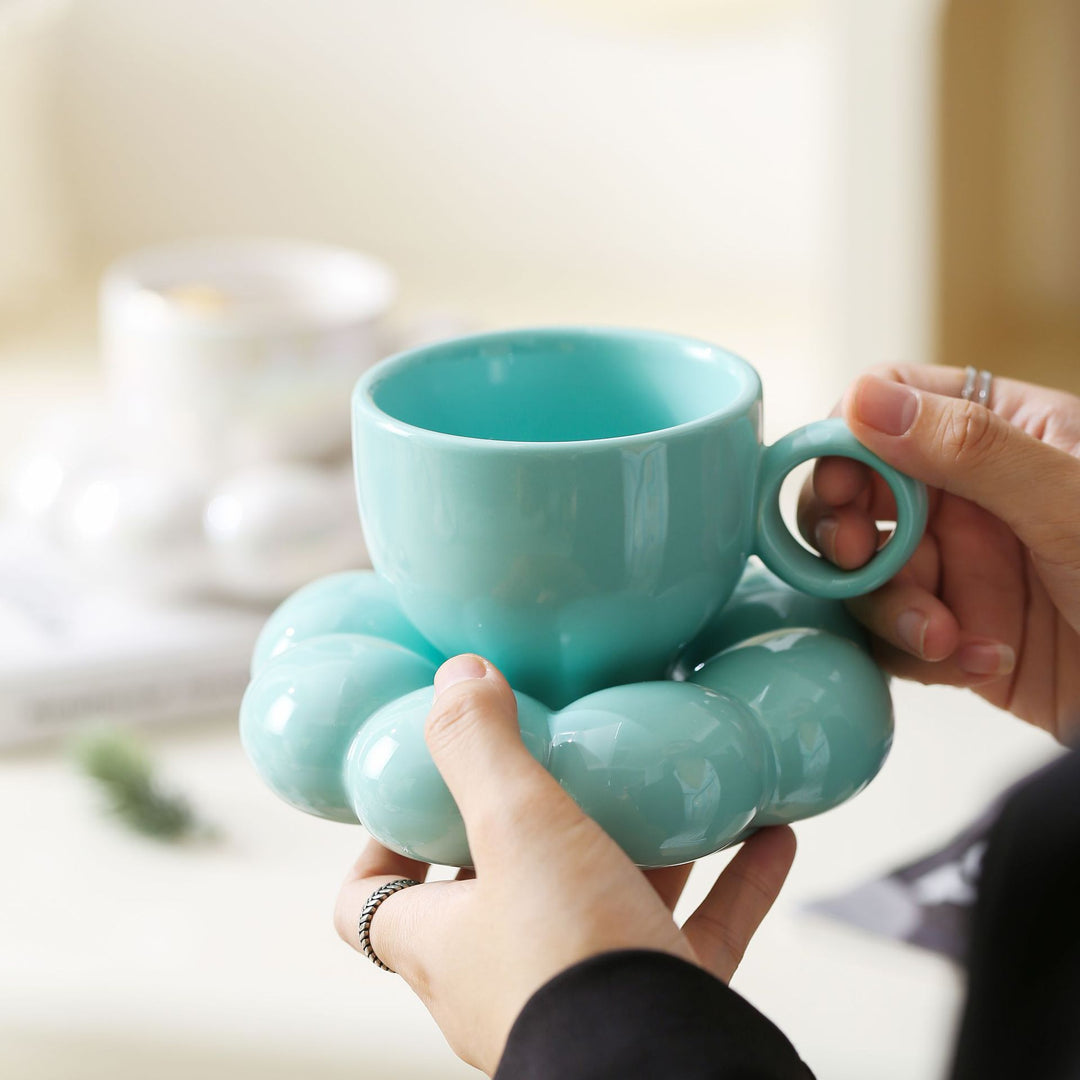Ceramic mug with sculptural bubble saucer