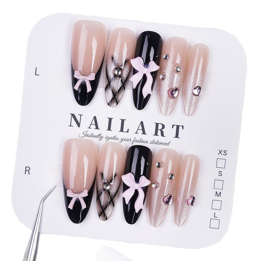 Artificial nails with playful bow design and glitter effects Kalsten