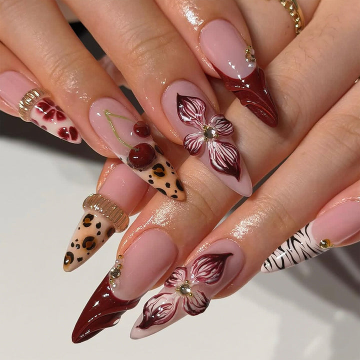 Artificial nail art with floral and animal motifs Kalsten