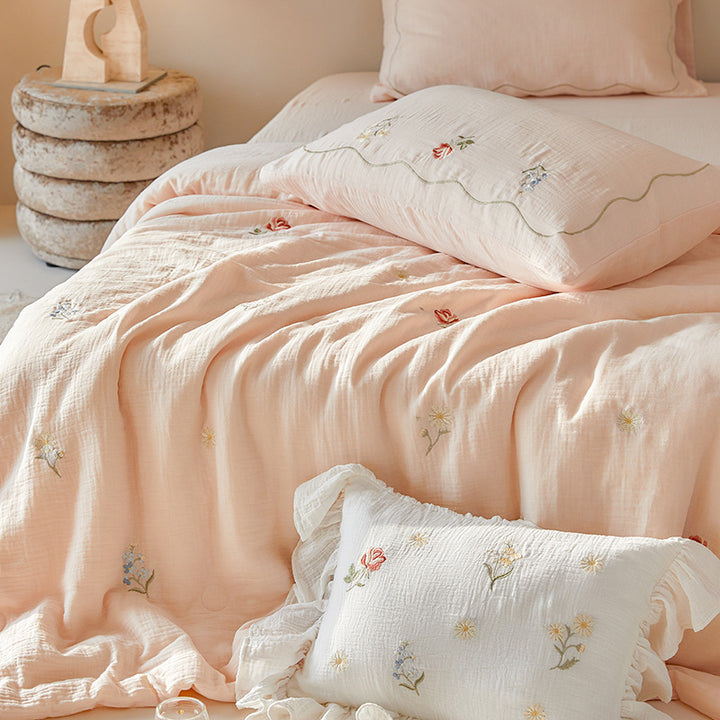 Light cotton gauze bedding set with fine floral embroidery and ruffle trim