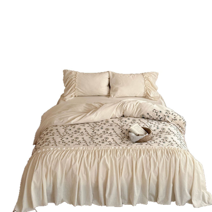 Bedding set with floral embroidered cover, gathered ruffle and cotton texture