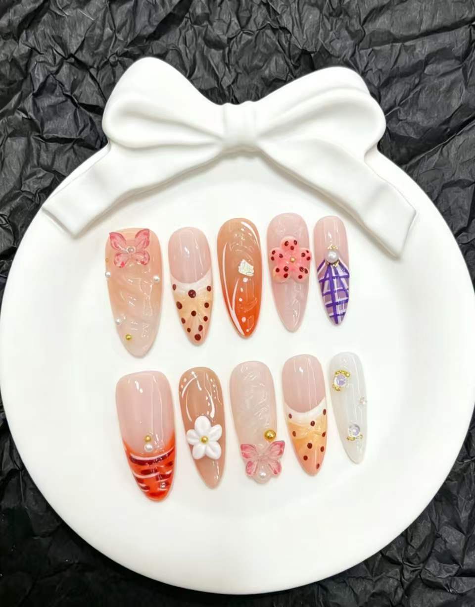 Artistic Press-On Nails Set with Floral and Decorative Accents