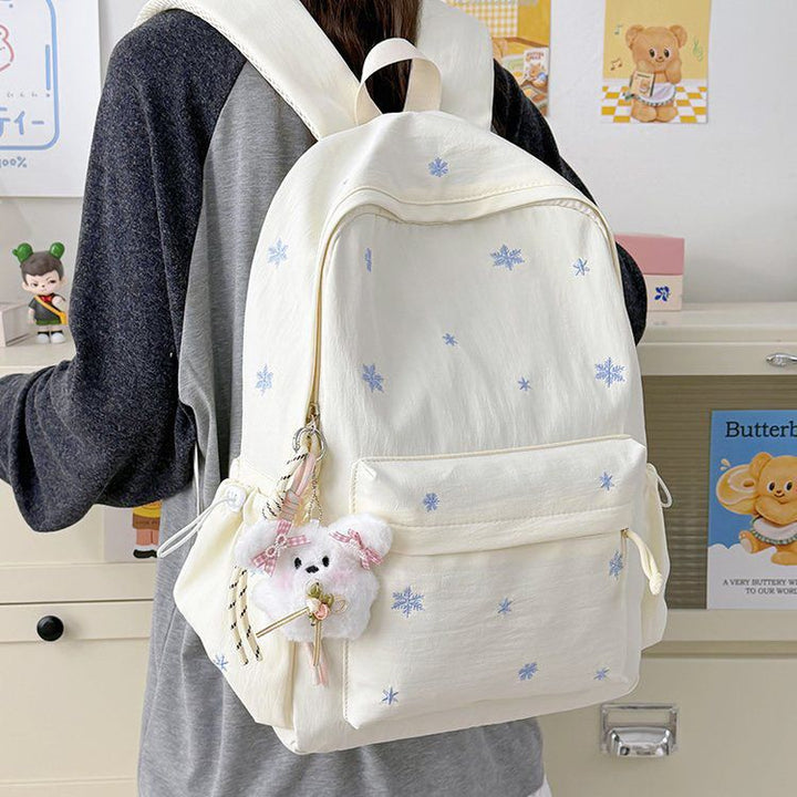 Playful backpack with fine embroidery Kalsten