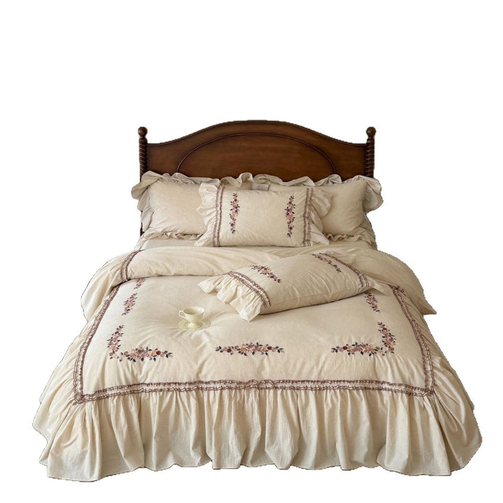 Romantic bedding set with ruffles and floral embroidery in linen look