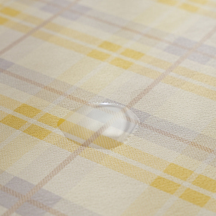 Oval wipeable placemat made of easy-care vinyl with a checked pattern Kalsten