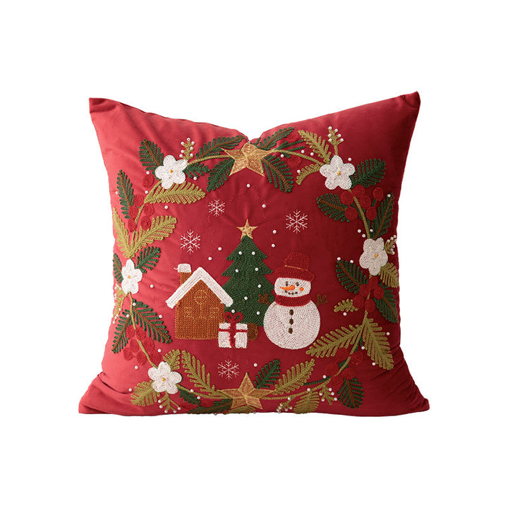 Festive embroidered decorative pillow with reindeer motif and removable cover