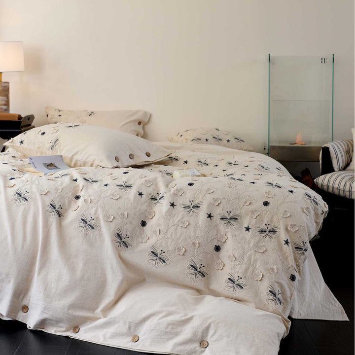 Embroidered cotton bedding set with wooden buttons and butterfly appliqués