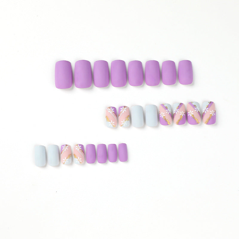 Artistic nail designs with floral motifs and glitter accents Kalsten