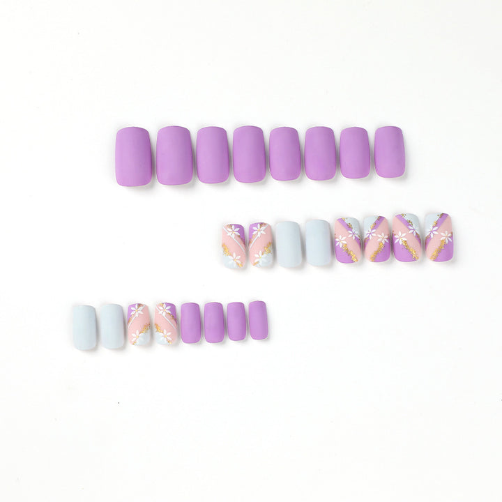Artistic nail designs with floral motifs and glitter accents Kalsten